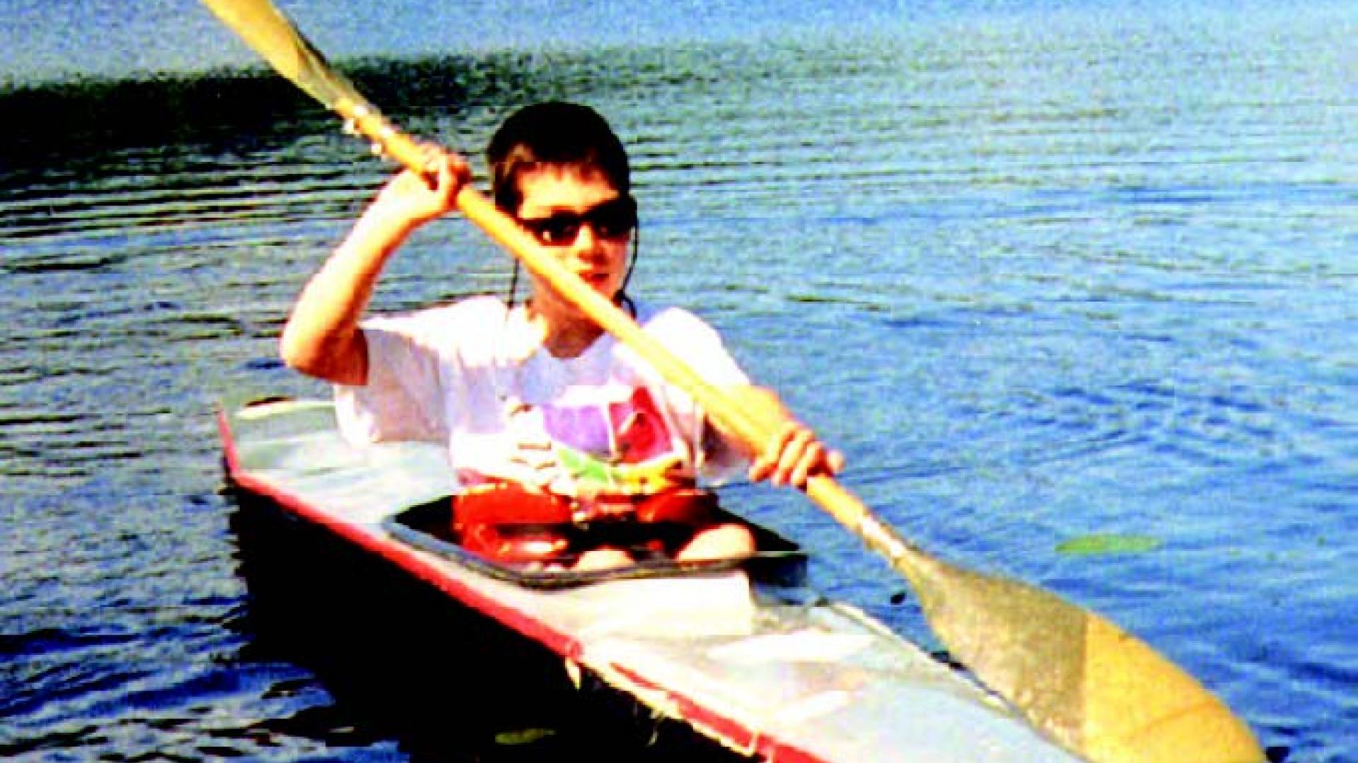 A young Wes Hammer paddles on Whonnock Lake.